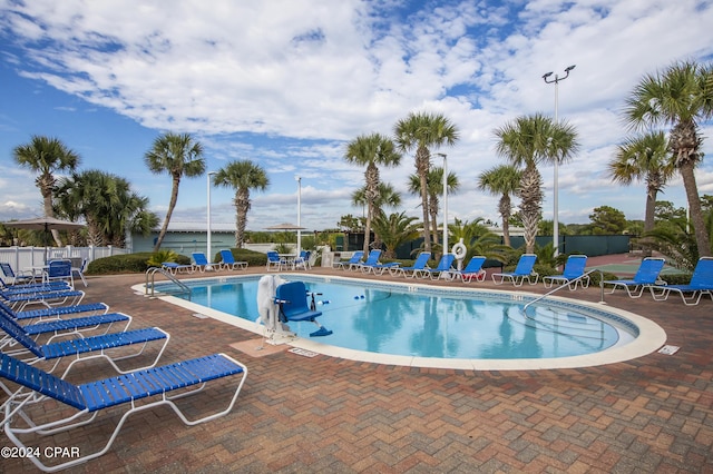 view of swimming pool featuring a patio area