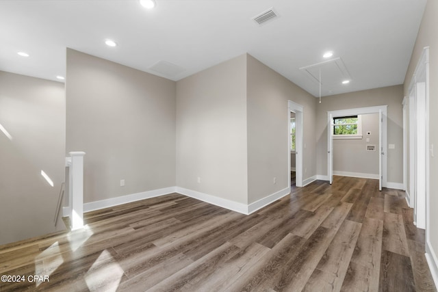 unfurnished room with hardwood / wood-style floors