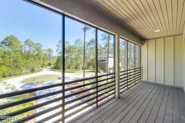 unfurnished sunroom with wooden ceiling