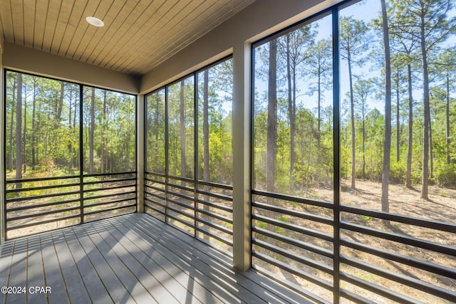 unfurnished sunroom featuring a wealth of natural light