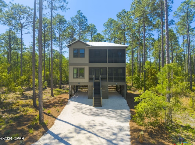 view of front facade with a carport