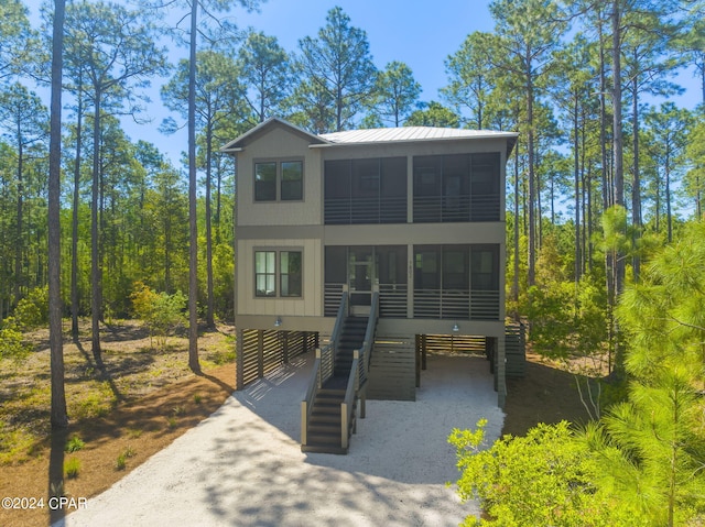 view of front of property with a sunroom