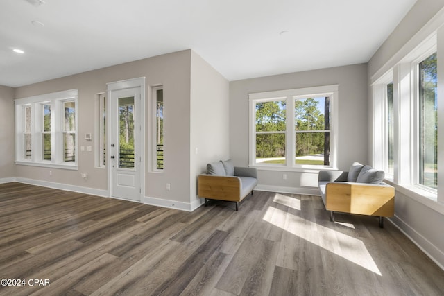 sitting room with dark hardwood / wood-style flooring