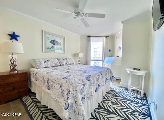 bedroom with crown molding and ceiling fan