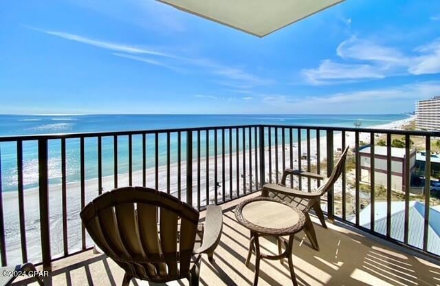 balcony with a view of the beach and a water view