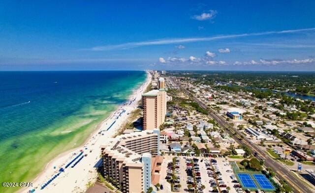 bird's eye view featuring a view of the beach and a water view