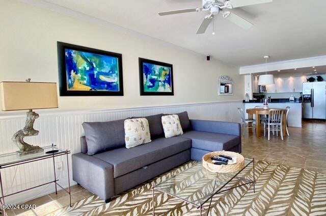 living room featuring ceiling fan and tile floors