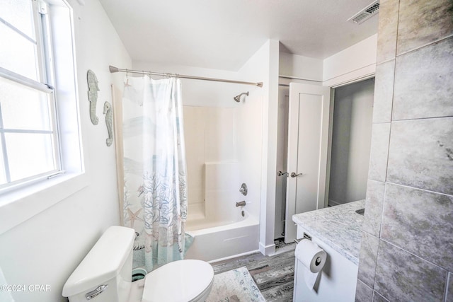 full bathroom with wood-type flooring, toilet, vanity, and shower / tub combo with curtain