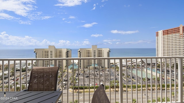 balcony featuring a water view and a view of the beach