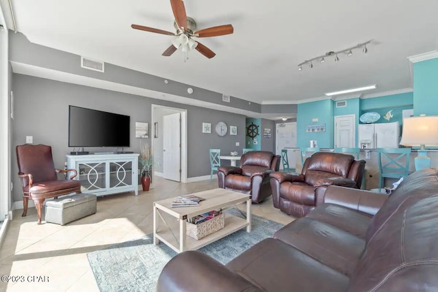 living room featuring ornamental molding, ceiling fan, light tile flooring, and track lighting