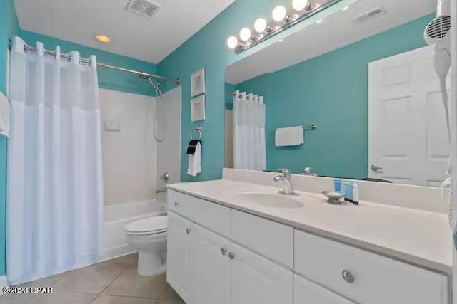 full bathroom with shower / tub combo with curtain, vanity, toilet, and tile flooring