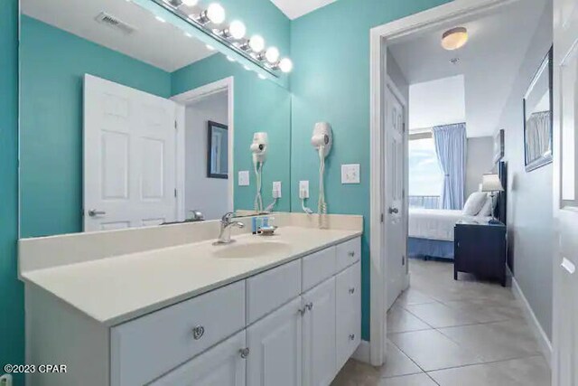 bathroom with vanity and tile flooring