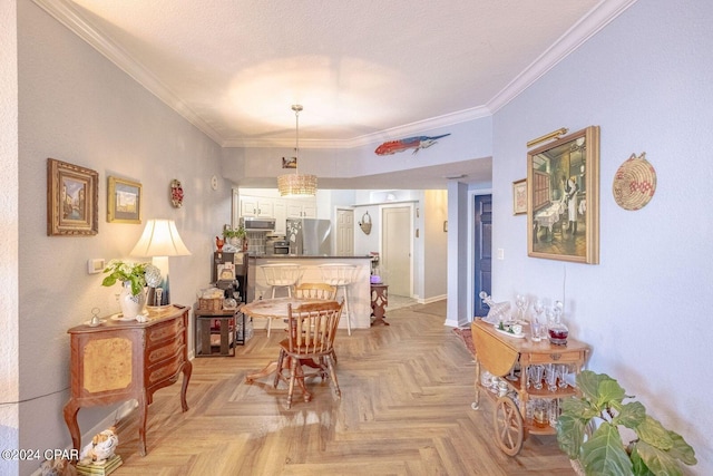 dining room featuring ornamental molding, light parquet floors, and a textured ceiling