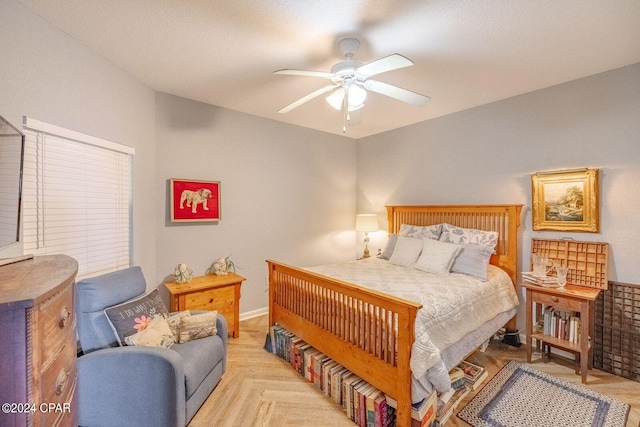 bedroom with light parquet floors and ceiling fan