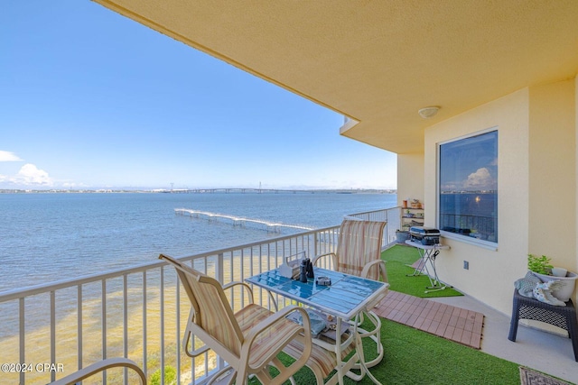 balcony featuring a water view