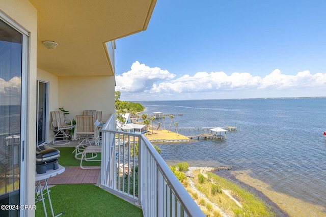 balcony featuring a water view