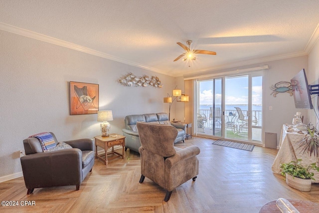 living room featuring light parquet floors, ceiling fan, crown molding, and a textured ceiling