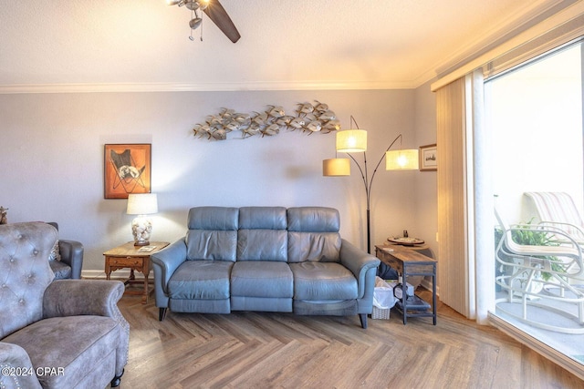 living room featuring ceiling fan, parquet floors, and crown molding