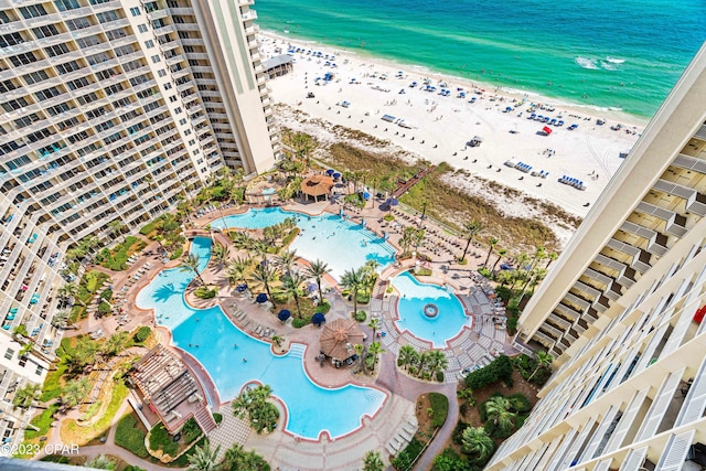 aerial view with a water view and a view of the beach