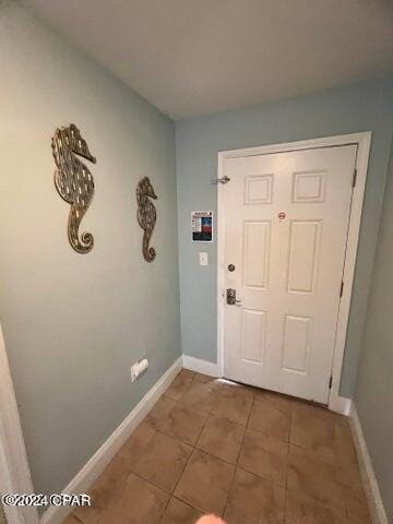 doorway featuring tile floors