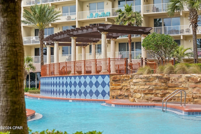 view of swimming pool with a pergola