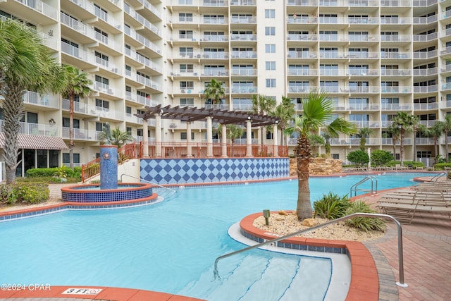 view of swimming pool with a pergola