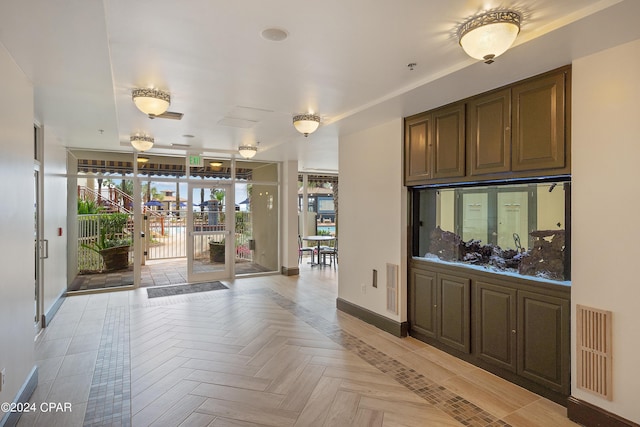 interior space featuring french doors and light parquet floors