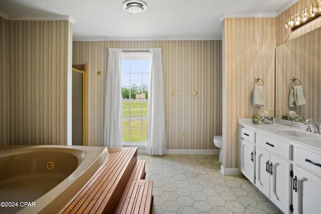 bathroom with a bathing tub, toilet, vanity, tile floors, and ornamental molding