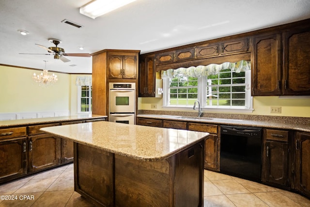 kitchen featuring double oven, black dishwasher, sink, a center island, and ornamental molding