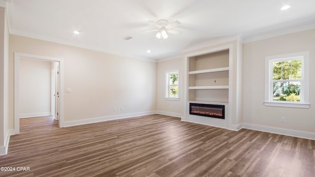 unfurnished living room with plenty of natural light, ceiling fan, and hardwood / wood-style floors