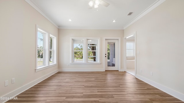 foyer entrance featuring ceiling fan, ornamental molding, and hardwood / wood-style flooring