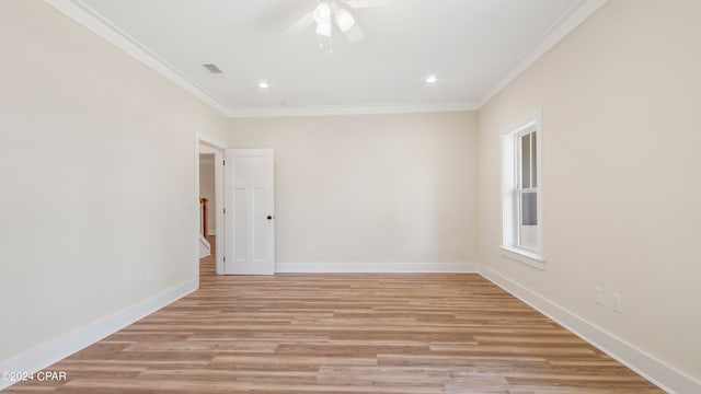 unfurnished room featuring ornamental molding, ceiling fan, and light wood-type flooring