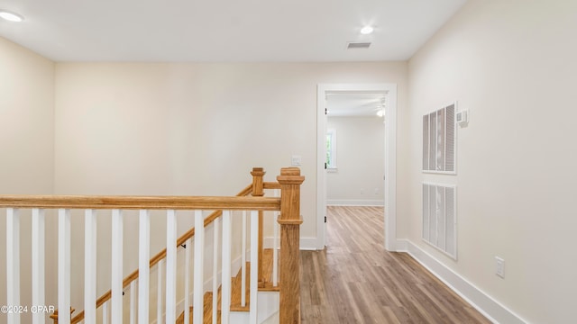 hallway featuring hardwood / wood-style flooring