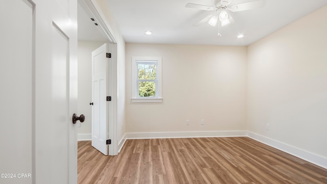 spare room featuring ceiling fan and light hardwood / wood-style floors