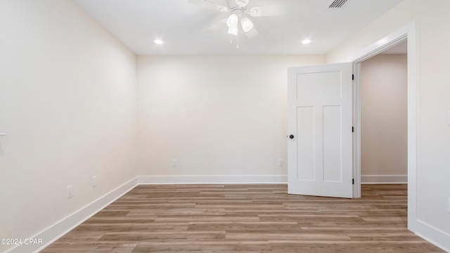 spare room with ceiling fan and hardwood / wood-style floors