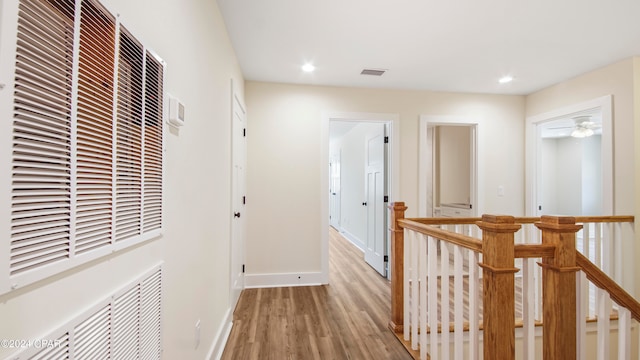 corridor with wood-type flooring