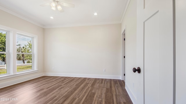 unfurnished room with dark wood-type flooring, ornamental molding, and ceiling fan