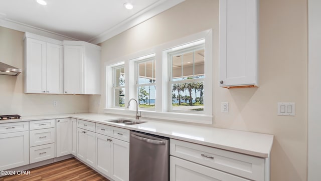 kitchen featuring white cabinets, dishwasher, crown molding, light wood-type flooring, and sink