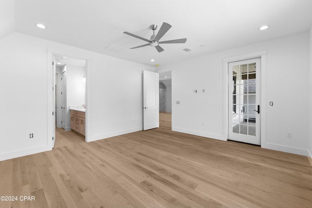 empty room with light hardwood / wood-style flooring and ceiling fan