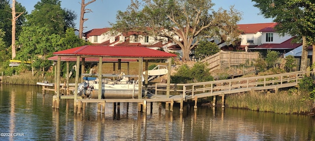 dock area featuring a water view