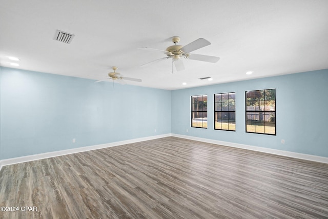 spare room featuring ceiling fan and hardwood / wood-style floors