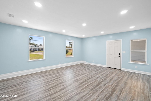 spare room with wood-type flooring