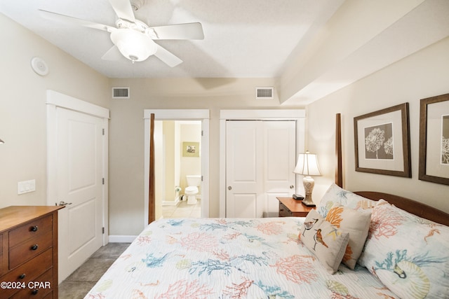 bedroom featuring ensuite bath, a closet, tile flooring, and ceiling fan