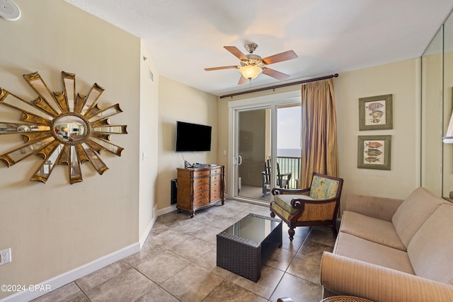 living room featuring tile flooring and ceiling fan