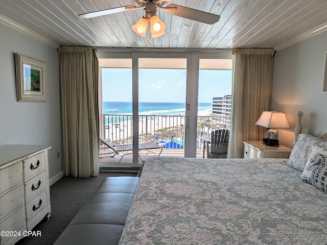 carpeted bedroom with a beach view, wooden ceiling, ornamental molding, a water view, and access to exterior