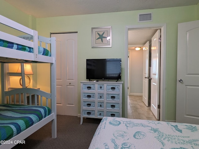 bedroom featuring a closet and a textured ceiling