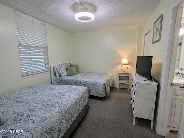 carpeted bedroom featuring a textured ceiling