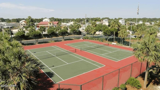 view of tennis court featuring fence