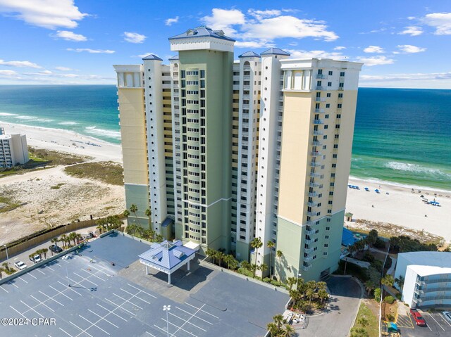 bird's eye view featuring a view of the beach and a water view