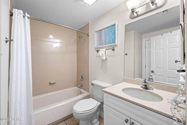 full bathroom with vanity, tile patterned floors, toilet, and shower / bath combo with shower curtain